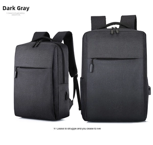 Detail of grey business backpack with waterproof fabric texture and USB charging port