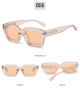 Detail view of transparent orange rectangular sunglasses with vintage thick frames