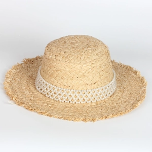 Flat top raffia sun hat with pearl trim and frayed edges for beach vacations