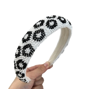 Handmade leopard print seed bead headband with black and white pattern in a wide padded design