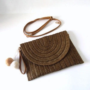 Brown paper straw woven clutch bag with tassel charms and detachable shoulder strap