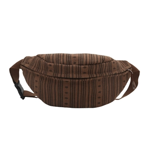 Brown striped corduroy fanny pack with adjustable strap and zipper closure for women