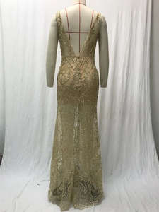 Detailed back view of gold sequin evening dress with V-back and fishtail lace design