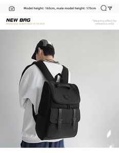 Side view of large black buckle backpack on model, showing size ratio and casual style