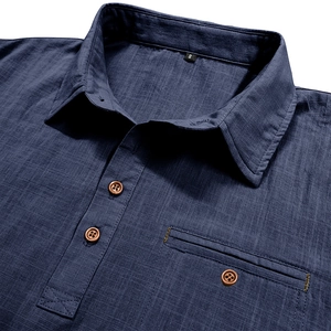 Detailed close-up of dark blue linen shirt collar and buttons with textured fabric