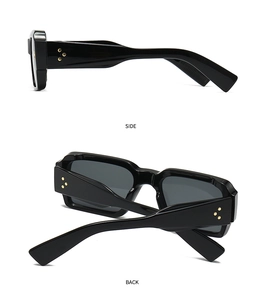 Detailed side and back view of black square sunglasses with golden star rivets