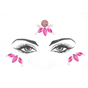 Pink leaf rhinestones and white pearls face jewels set for music festival eye makeup