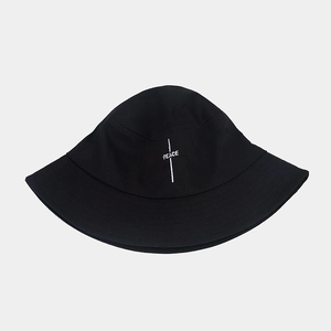 Retro black cotton bucket hat featuring white PEACE embroidery in a minimalist streetwear style