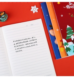 Detail of A5 Christmas notebook with lined pages showing date and number header