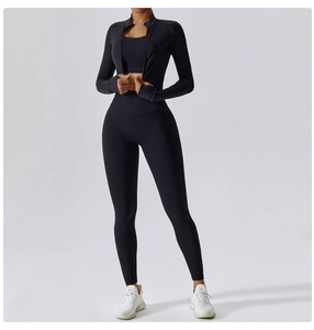 Detail of black sports jacket with thumb holes and high-waisted yoga set fit