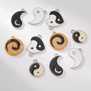 Yin Yang Tai Chi enamel alloy charms set in silver and gold with rhinestone accents
