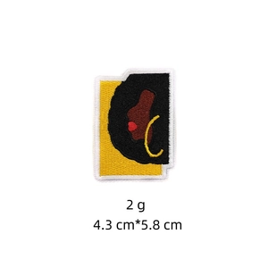 Close-up of African girl cartoon embroidery patch showing 4.3x5.8cm size and texture