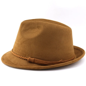 Detailed view of the tan suede cowboy hat featuring a braided band and tassel accent