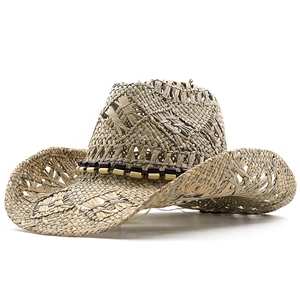 Close-up of hand-woven straw cowboy hat featuring decorative beads and breathable texture