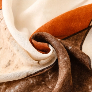 Detailed macro view of the soft cotton-linen scarf with abstract geometric ink pattern