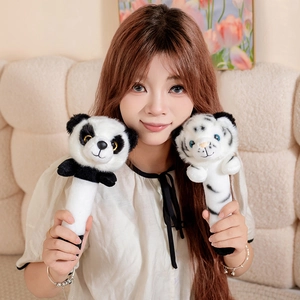 Cute panda and white tiger plush massage sticks held by a model in a cozy home setting
