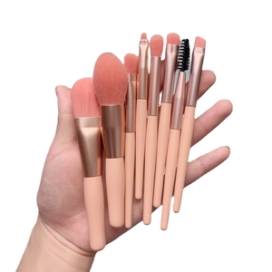8-piece mini makeup brush set with soft bristles and pink handles for portable beauty use