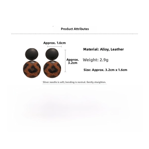 Detailed view of leopard print heart drop earrings with dimensions and material specs
