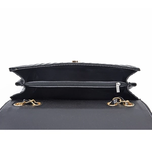 Black woven large capacity shoulder bag interior with zipper compartment and gold hardware