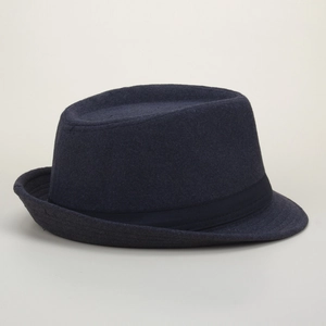 Close-up of the textured navy wool felt fabric and grosgrain ribbon band on the fedora