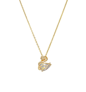 Detail of gold swan pendant necklace with micro-pave white crystals on white background