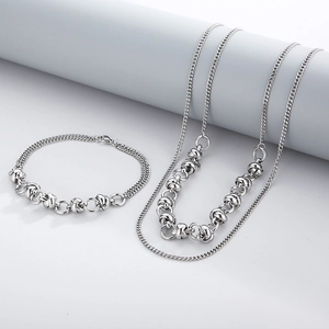 Silver stainless steel layered necklace and bracelet set with industrial knot design