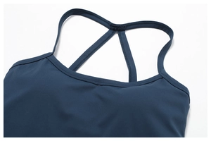 Detail of navy blue sports tank top with thin straps and smooth flat seam neckline