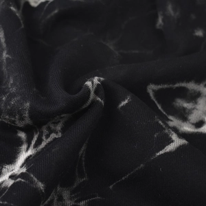 Black tie-dye slouchy beanie hat featuring minimalist marble print and soft knit texture