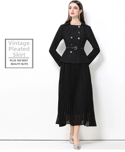 Détail de la robe noire à double boutonnage montrant l'ourlet plissé et la ceinture