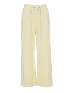 Détail du pantalon large beige clair avec cordon de serrage élastique et maille douce