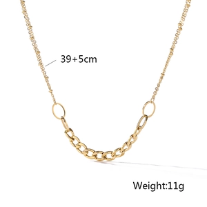 Detailed view of layered feather and tree of life gold necklace with 39+5cm chain length