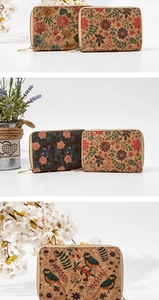 Detail of cork wood small wallets with floral and bird prints and zipper closure