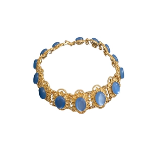 Vintage gold oval necklace featuring sky blue gemstones in a retro palace choker style