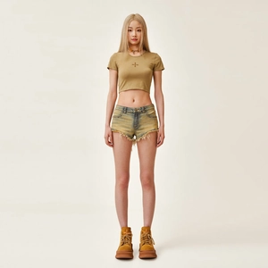 Slim fit cropped t-shirt and low waist frayed denim shorts with platform boots