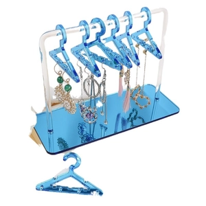 Transparent blue acrylic earring holder with creative mini clothes hanger display design