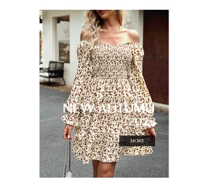 Detail of yellow floral dress showing off-shoulder neckline and elastic smocked waist