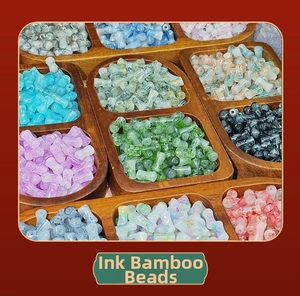Macro view of ink wash bamboo shaped glass beads in various colors for DIY jewelry