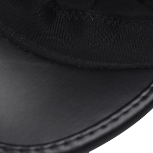 Close-up of black PU leather beret seams showing precise stitching and elastic band detail