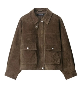 Close-up of a brown suede bomber jacket with large flap pockets and silver metal snaps