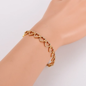 Bracelet luxueux en forme de cœur doré avec pavé de zircons pour femmes