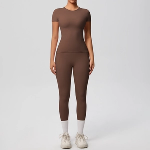 Women's dark brown short sleeve yoga set featuring high-waist leggings and slim-fit tee