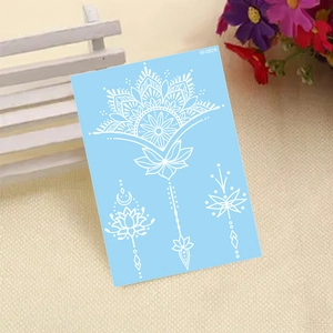 White lace henna temporary tattoo sticker with mandala flower patterns on blue backing