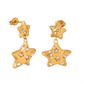 Elegant gold star drop earrings featuring crystal pavé inlay and a matte finish