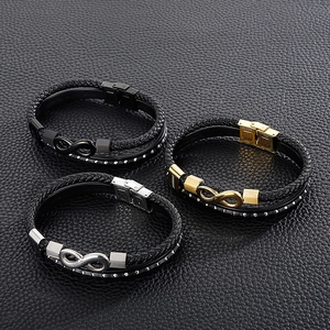 Detail of multi-layer leather bracelets with infinity symbols and stainless steel clasps