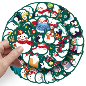 Close-up of cute snowman stickers being held to show size and high-quality detail
