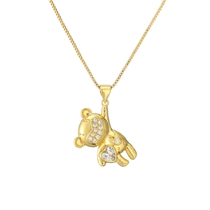 Fashionable gold bear necklace with sparkling cubic zirconia and a heart shaped gemstone