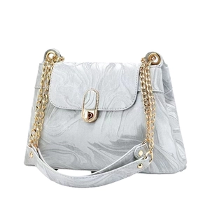 Elegant marble pattern shoulder bag with gold chain strap and metallic twist lock