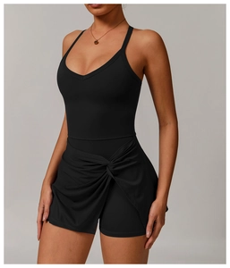 Detail of cross knot draped skirt on black v-neck backless athletic tennis romper