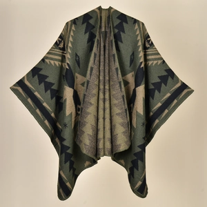 Detail of ethnic geometric knit pattern on warm winter poncho with stitched edges