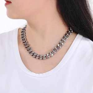 Silver stainless steel Cuban link necklace with CNC diamonds worn by a model
